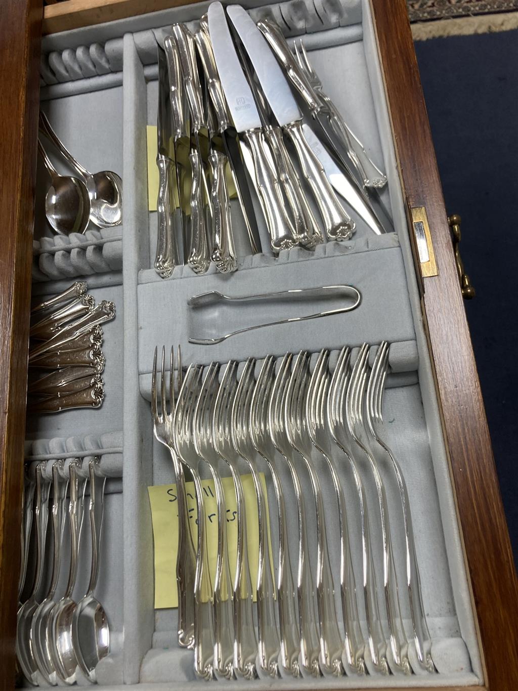 A canteen of plated cutlery contained a fitted case, settings for twelve